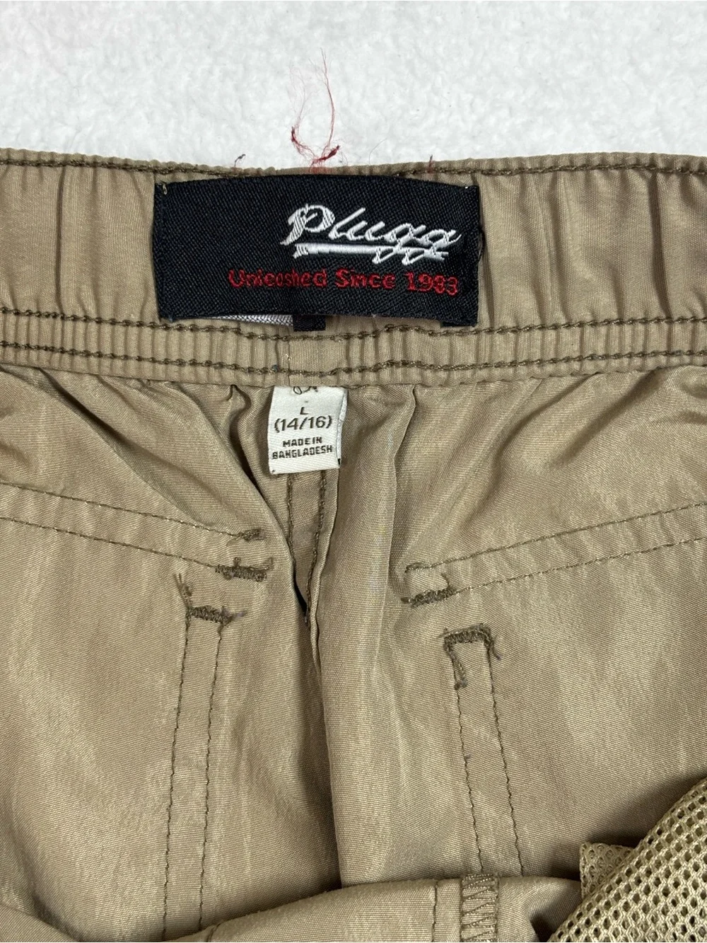 Plugg cargo Boy shorts with elastic waist, and multiple flap pockets